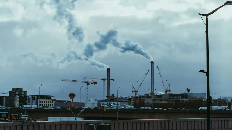 A modern white industrial facility under a clear sky
